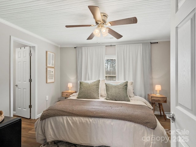 bedroom featuring ceiling fan, crown molding, and wood finished floors