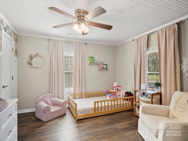 bedroom with ceiling fan, ornamental molding, wood finished floors, and baseboards