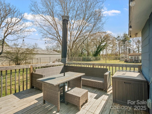 wooden deck with outdoor lounge area