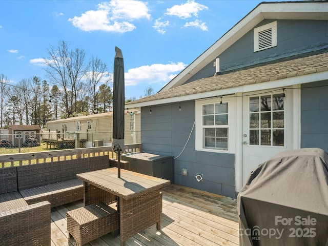 wooden deck featuring an outdoor hangout area and grilling area