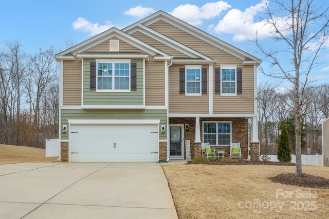 view of front of home featuring a garage, a porch, and driveway