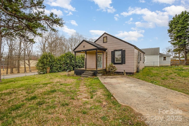 bungalow-style house with covered porch and a front yard