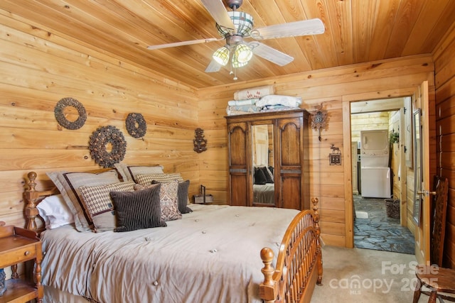 bedroom with carpet floors, wood ceiling, and wood walls