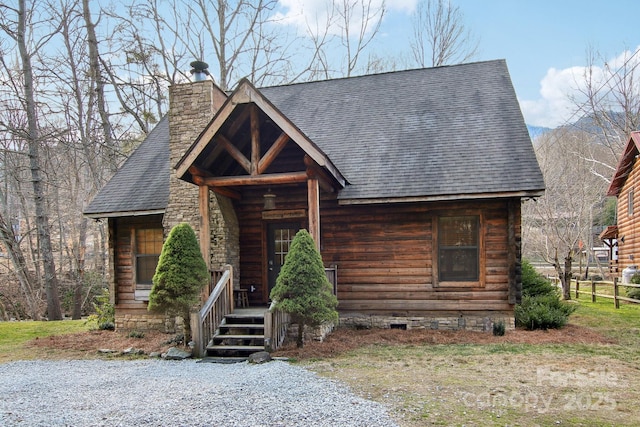 log home featuring a shingled roof, crawl space, and a chimney