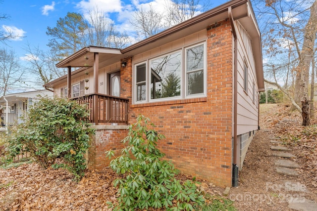 view of front of home featuring brick siding