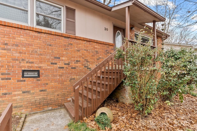 entrance to property with brick siding