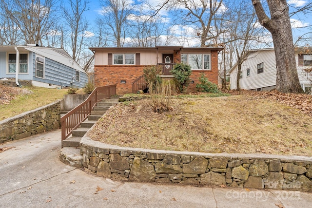 ranch-style house with crawl space and brick siding