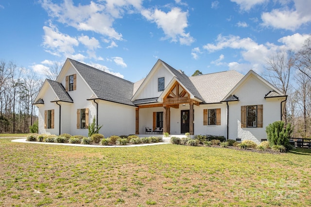 modern farmhouse style home with a front lawn, roof with shingles, a porch, and board and batten siding