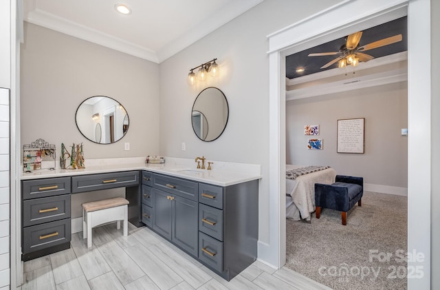 bathroom featuring recessed lighting, a ceiling fan, baseboards, vanity, and crown molding