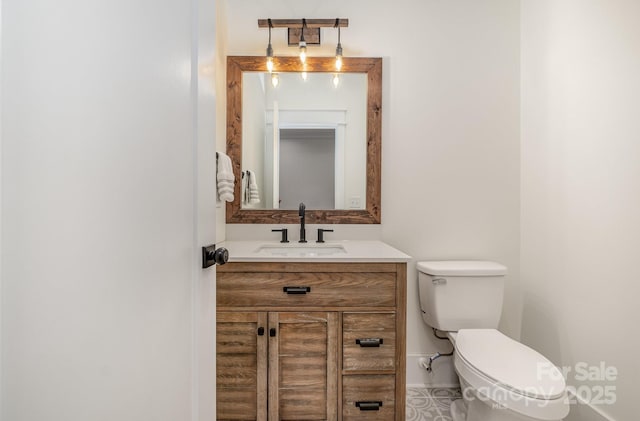 half bath with vanity and toilet