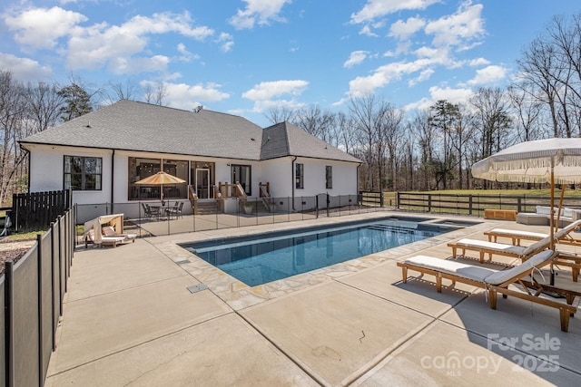 view of pool featuring a patio area, fence, and a fenced in pool