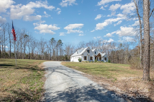 view of road with gravel driveway