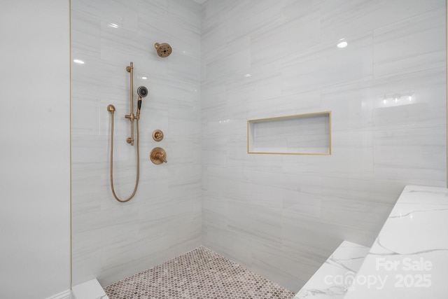 full bathroom with tiled shower