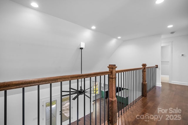 hallway featuring recessed lighting, baseboards, and wood finished floors