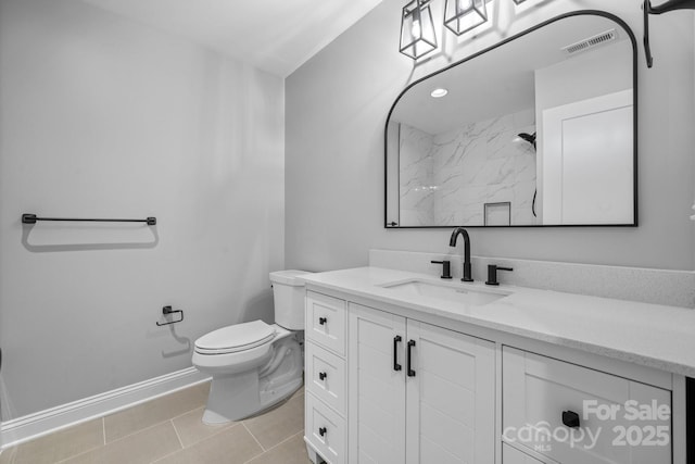 full bathroom featuring visible vents, toilet, vanity, baseboards, and tile patterned floors