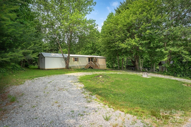 843 Deep Gap Loop Rd, Flat Rock, NC 28731 - view of front of property featuring gravel driveway and a front lawn