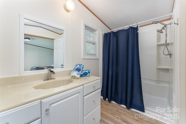 843 Deep Gap Loop Rd, Flat Rock, NC 28731 - full bathroom with vanity, curtained shower, wood finished floors, and a textured ceiling