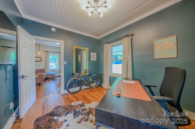124 Dodge St, Asheville, NC 28803 - office area featuring wood finished floors, a chandelier, baseboards, and crown molding