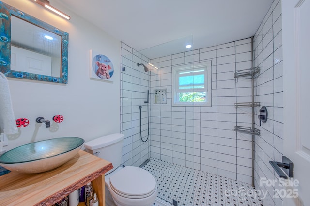 124 Dodge St, Asheville, NC 28803 - bathroom with a tile shower, a sink, and toilet