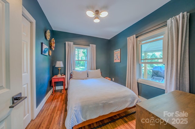 124 Dodge St, Asheville, NC 28803 - bedroom with light wood-type flooring and baseboards