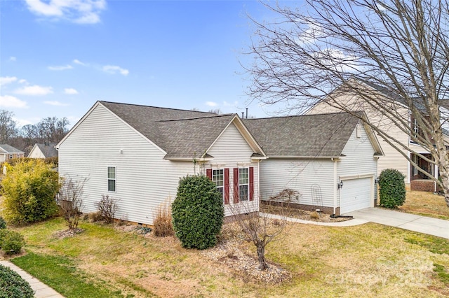 view of front facade with a garage, concrete driveway, a front lawn, and a shingled roof