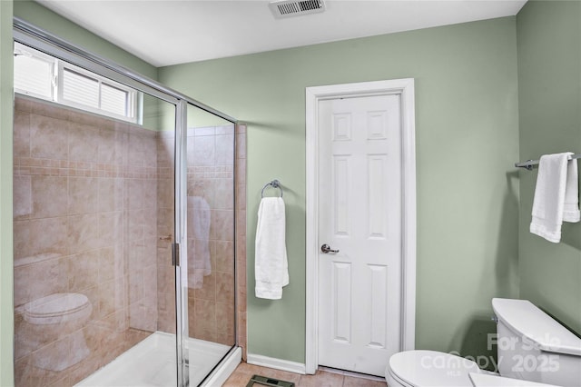 full bathroom featuring baseboards, visible vents, a shower stall, tile patterned floors, and toilet