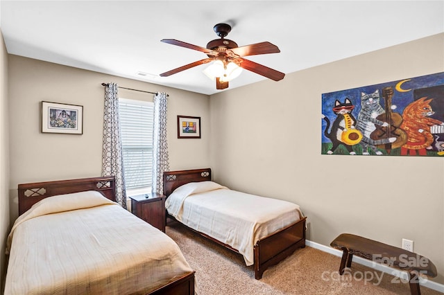 carpeted bedroom with baseboards, visible vents, and ceiling fan