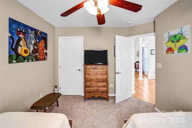 carpeted bedroom featuring ceiling fan