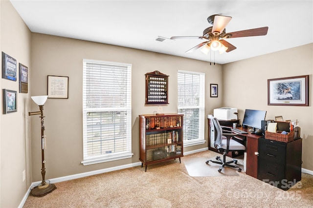 home office with a ceiling fan, carpet, and baseboards