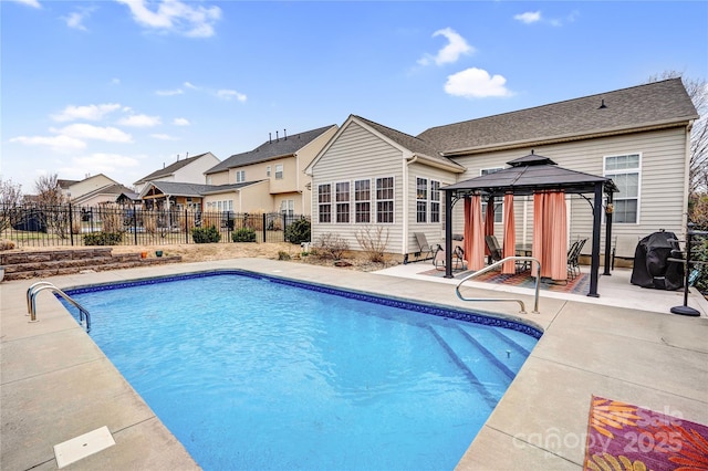 view of swimming pool with a gazebo, a fenced in pool, fence, and a patio area