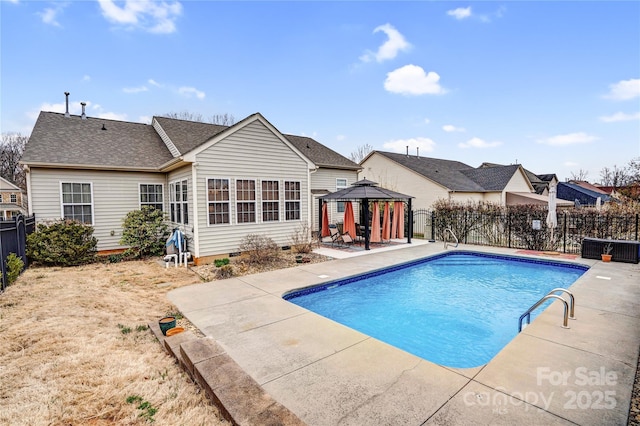 view of swimming pool featuring a gazebo, a fenced in pool, a fenced backyard, and a patio area