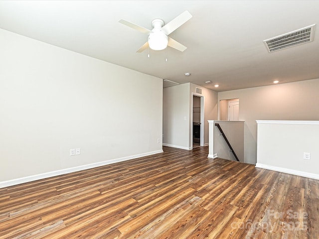 empty room with recessed lighting, visible vents, baseboards, and wood finished floors