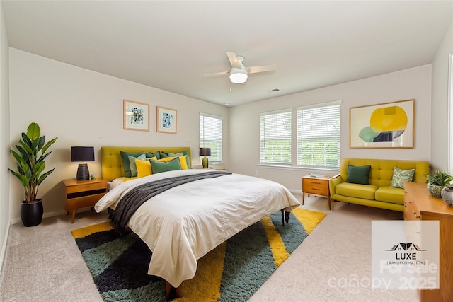 bedroom with carpet, visible vents, ceiling fan, and baseboards