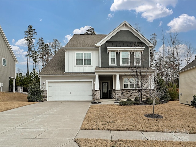 craftsman inspired home with a porch, an attached garage, board and batten siding, stone siding, and driveway