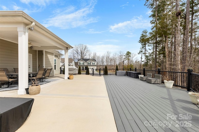 wooden terrace featuring outdoor dining space and ceiling fan