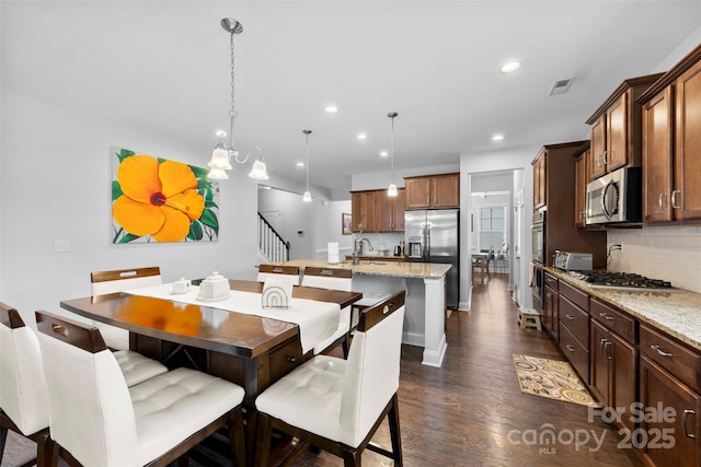 dining area featuring stairs, dark wood-style flooring, visible vents, and recessed lighting