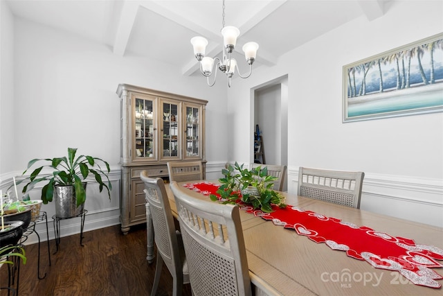 dining room with dark wood-style flooring, beam ceiling, and a notable chandelier