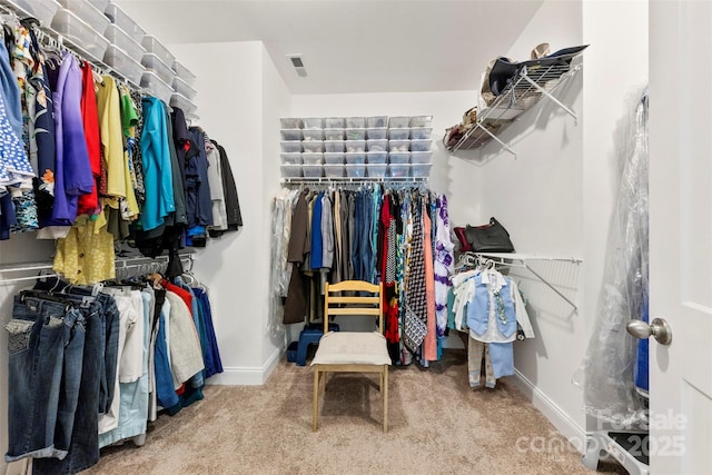 walk in closet with carpet floors and visible vents