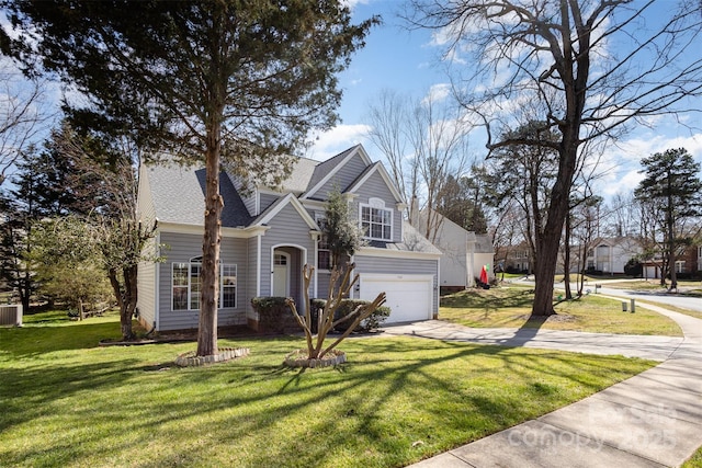 traditional-style house featuring central AC, driveway, a front lawn, and a garage