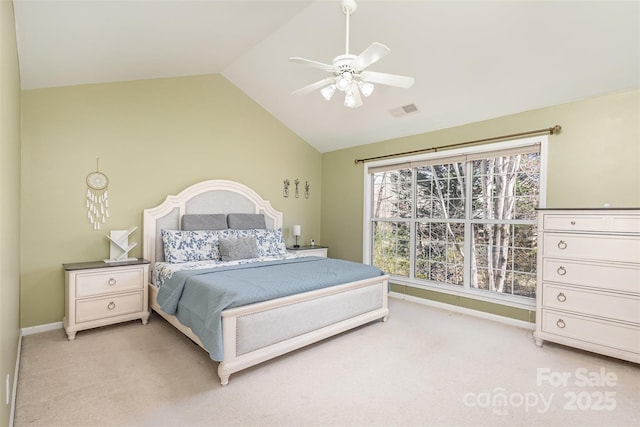 bedroom featuring visible vents, baseboards, lofted ceiling, light colored carpet, and ceiling fan