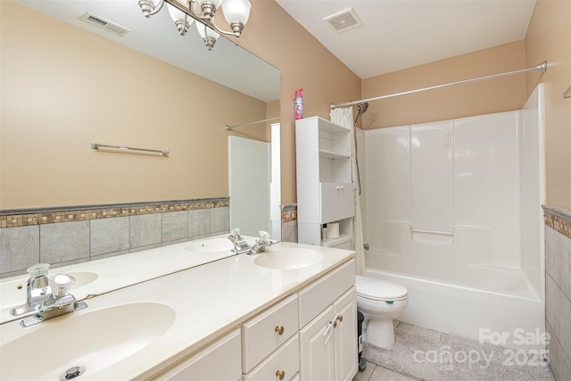 bathroom with visible vents, toilet, and a sink