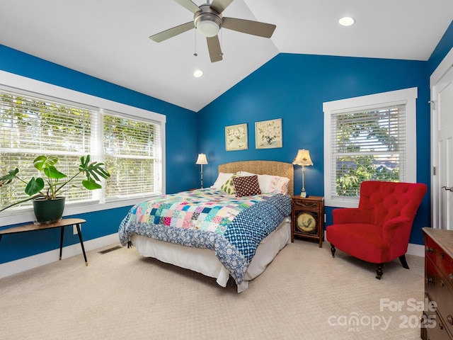 bedroom featuring carpet floors, multiple windows, vaulted ceiling, and visible vents