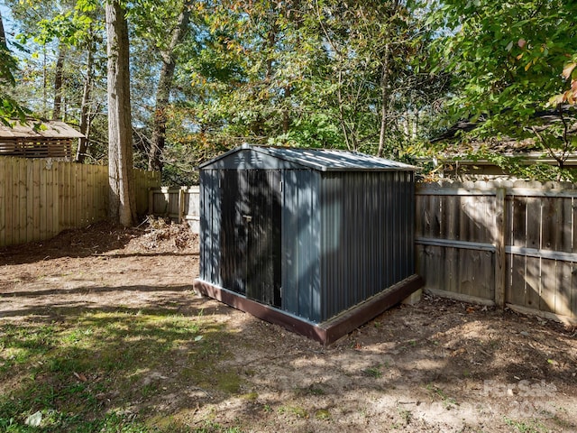 view of shed featuring a fenced backyard