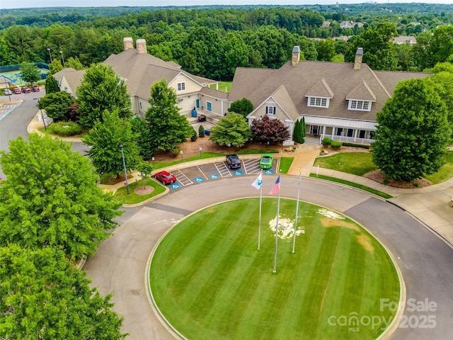 drone / aerial view featuring a view of trees