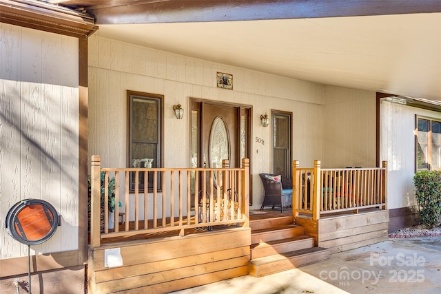 doorway to property featuring covered porch