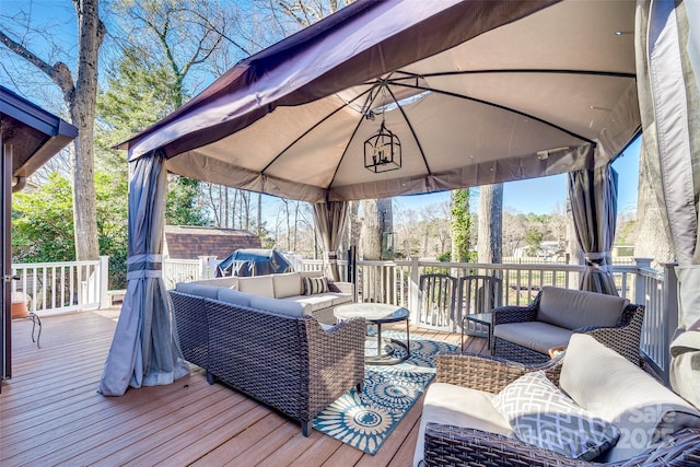 deck with an outdoor living space and a gazebo