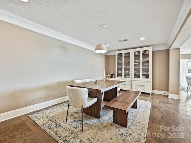 dining area with recessed lighting, visible vents, ornamental molding, a textured ceiling, and baseboards