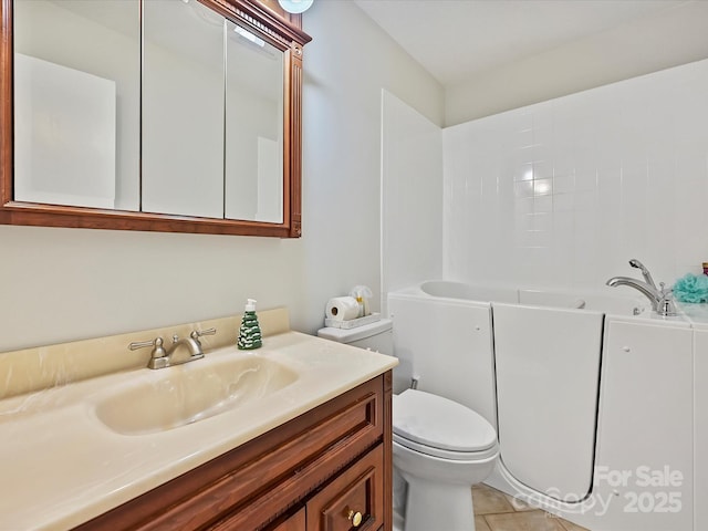 bathroom with a tub to relax in, tile patterned floors, toilet, and vanity