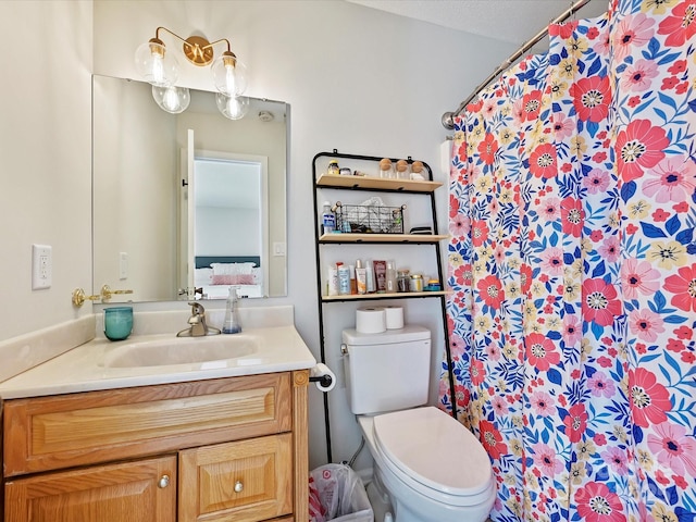 full bathroom with toilet, a shower with curtain, and vanity