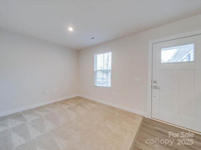 entrance foyer featuring light wood finished floors, recessed lighting, visible vents, and baseboards